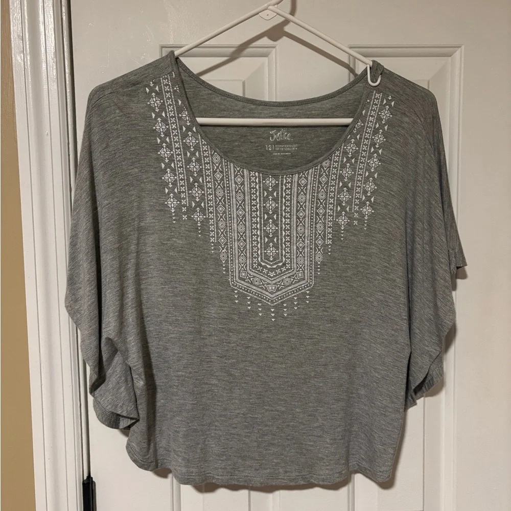 Beautiful Justice top with white decorative detail